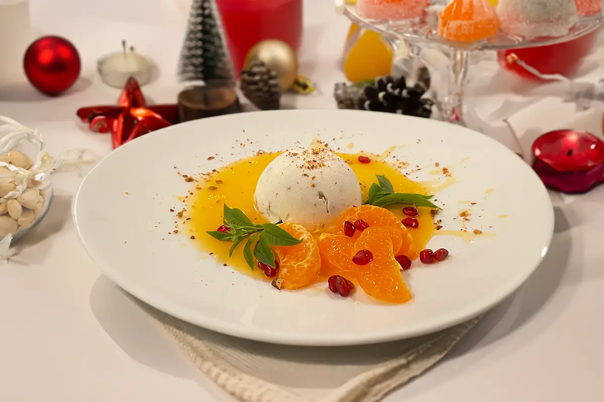 Semifreddo al ricordo di torrone, con salsa agli agrumi e menta